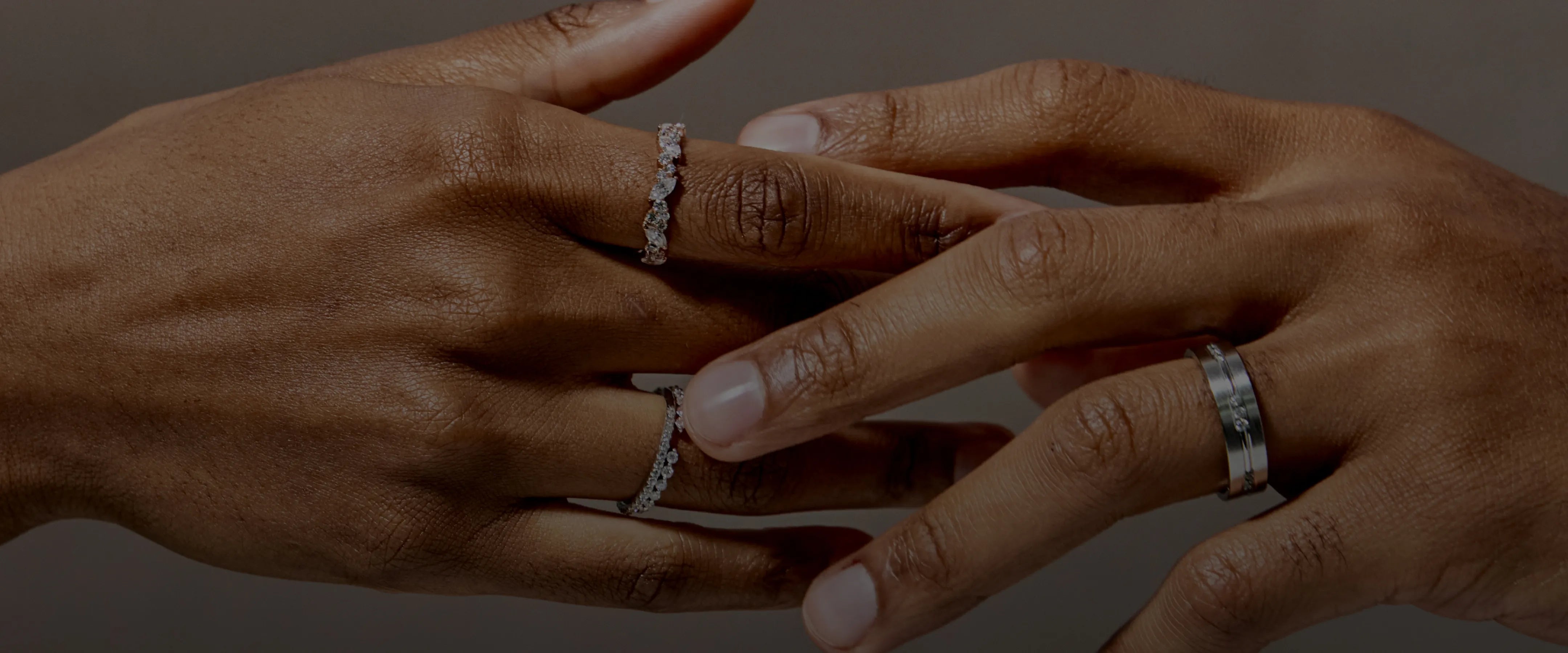 Hands interlocked with rings