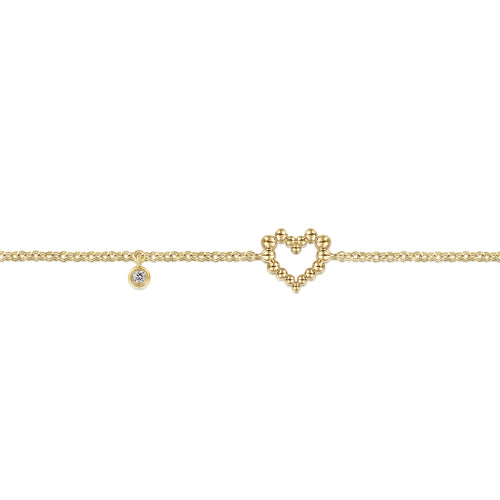 Bracelet cœur en or jaune 14 carats avec breloque diamant serti clos