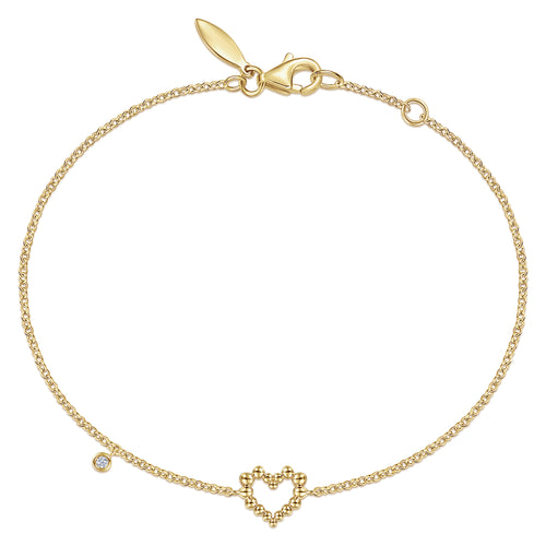Bracelet cœur en or jaune 14 carats avec breloque diamant serti clos