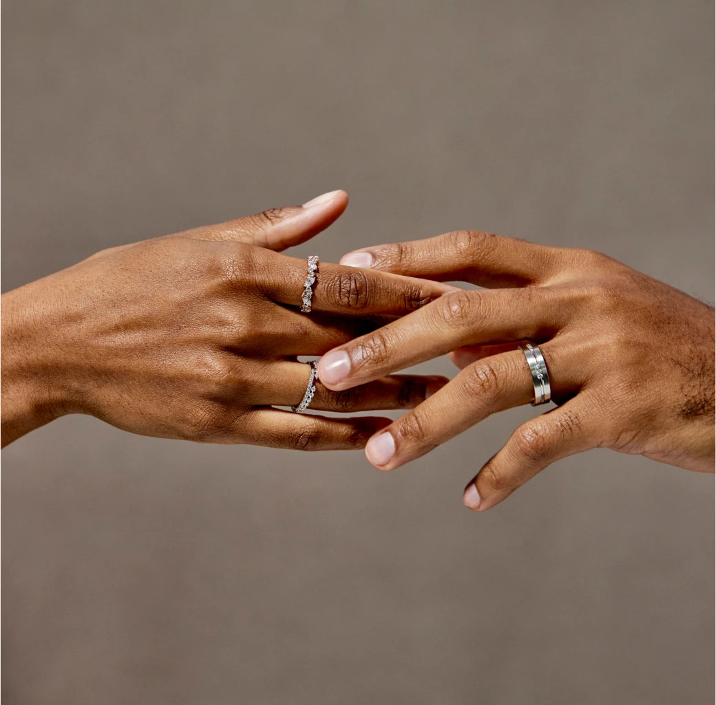 Hands interlocked with rings